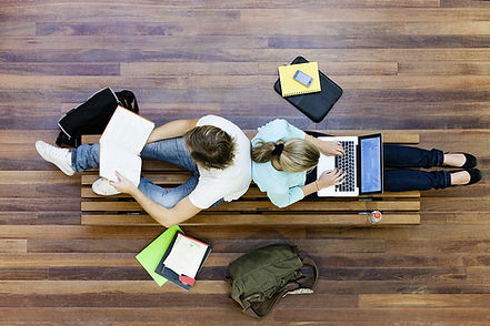 Male and female students doing schoolwor