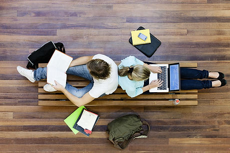 Male and female students doing schoolwor