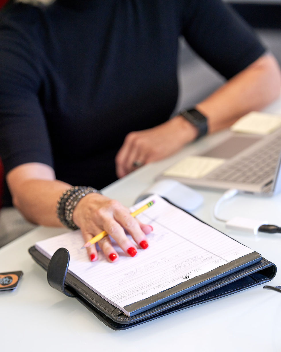 hand resting on notepad