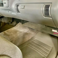 Angled photo from passenger side showing installed chrome billet HVAC cover.