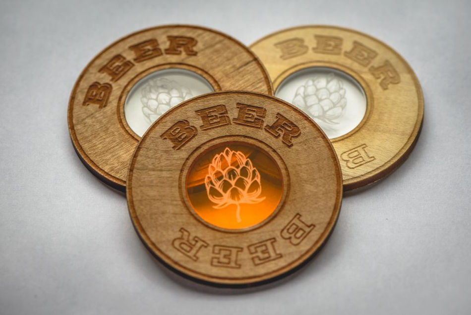 Wood engraves and cuts beautifully with great detail. We can effectively cut up to 3/8” thick with multiple passes. Charring will always occur on the laser cut edge. Different woods cut engrave differently. Cherry, basswood and alder are some of our favorites.