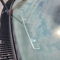 Angled photo of installed chrome dash saver in chevy truck.