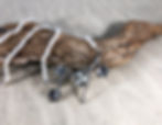 Cast silver necklace with branch, leaves, and nest with pearl eggs