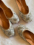 Handcrafted ivory jutti for women with intricate silver zari work