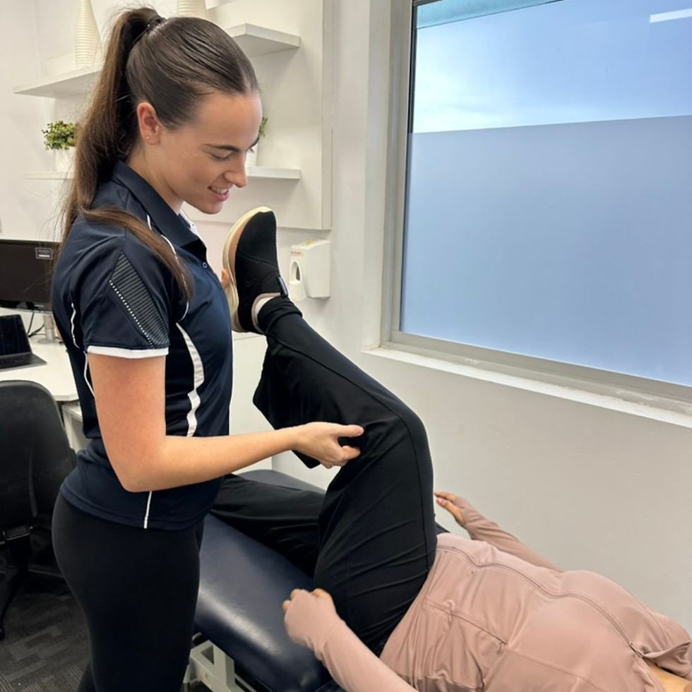 Exercise physiologist performing a lower body movement assessment during a Functional Wellbeing appointment.