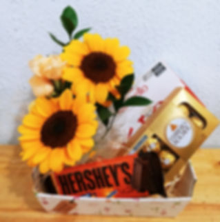 Cesta de chocolate com girassol