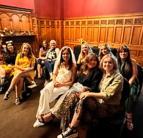 Forster performing a seance to a hen party