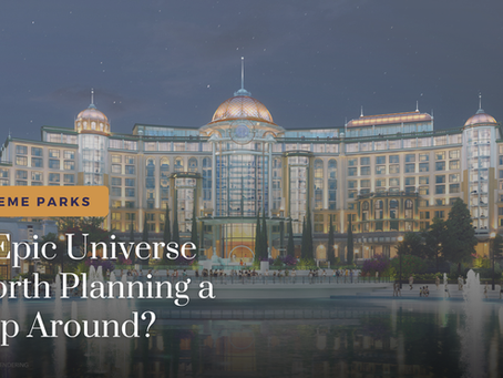 Epic Universe's Grand Helios Hotel at night with fountains in the water water in front of it