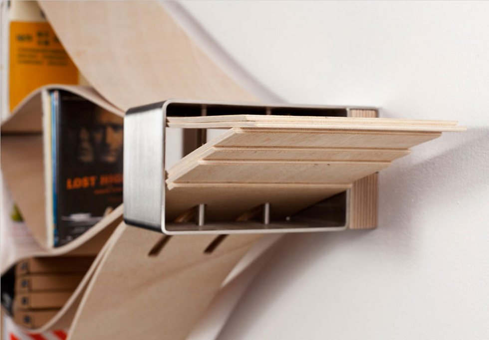Stainless Steel Collars at the end of a flexible wooden shelf