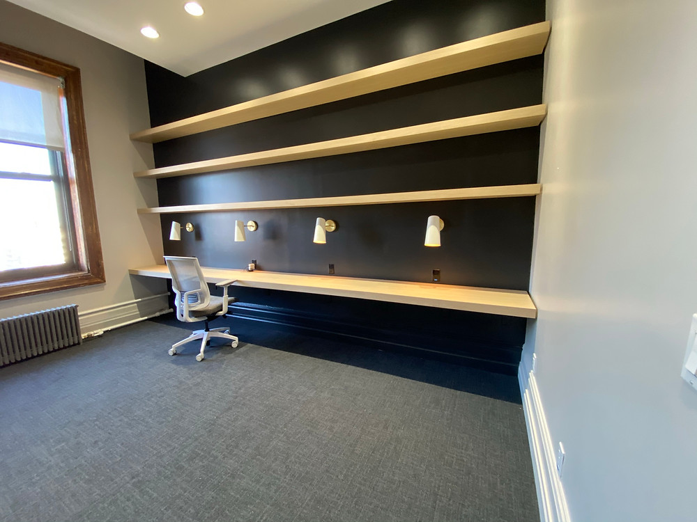 Custom Made Floating Bookshelves in an office