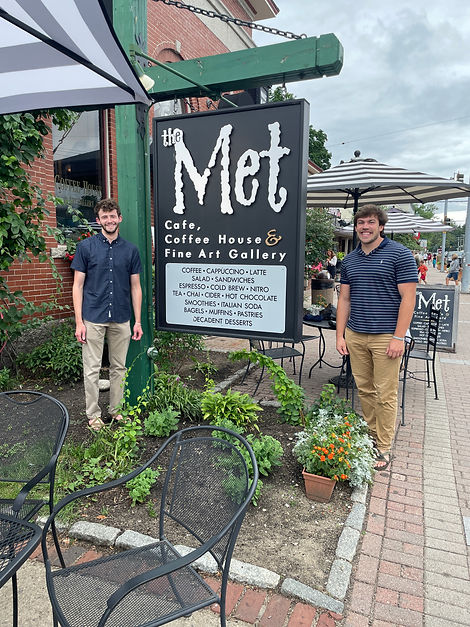 Jacob Freedman and Nathaniel Klein outside The Met Cafe, Coffee House, and Fine Art Gallery