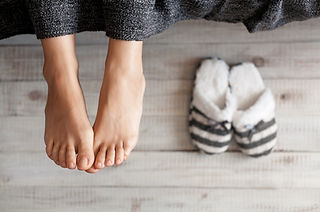 Soft photo of woman feet with slippers,