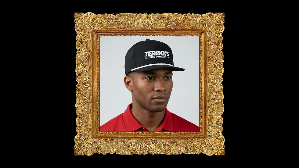 Man in red shirt and black cap with "Terrick's Moving Company LLC," framed in ornate gold, neutral expression, black background.