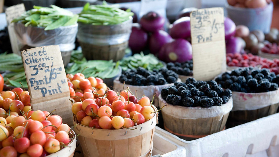 Eye-level view of the signature Bumblebee Cake on a rustic wooden table