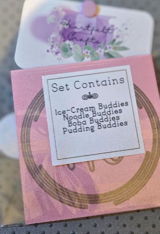 Mini Gourmet Feast V1 set list on pink packaging