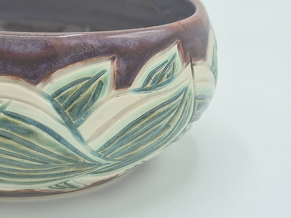 Thumbnail: Hand Thrown, Glazed and Carved deep Bowl with a rose motif.