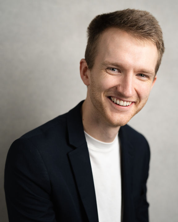 Bobby Goulder smiling jacket headshot