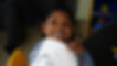 Little girl smiling at camera.