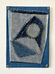Scraps of denim sewn onto cardstock