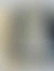 strips of blue fabric selvedge sewn together underneath a piece of batting