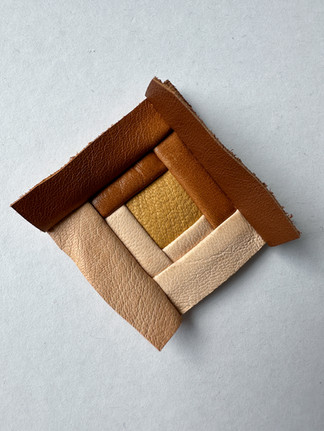 log cabin quilt block made out of leather