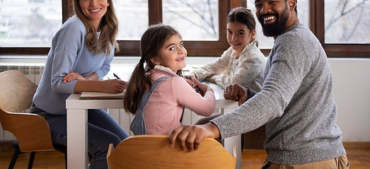 side-view-family-sitting-table_23-2150231681.jpg