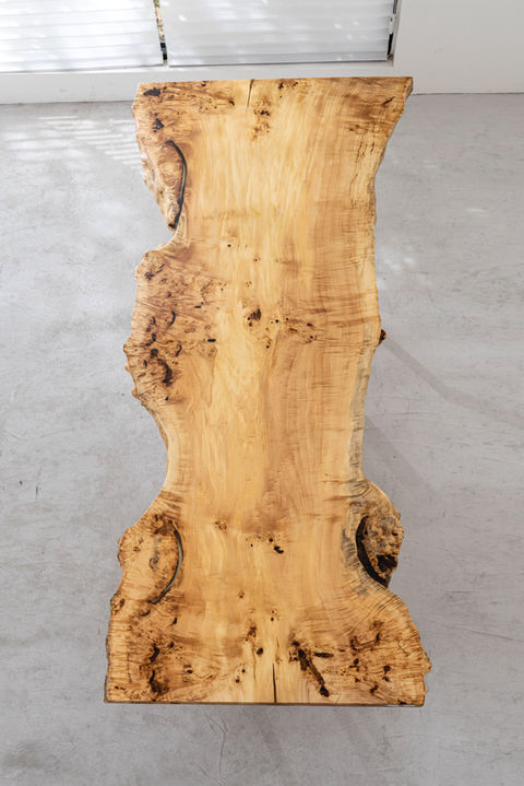 You prefer abstract art over traditional landscapes. You want an intensely complex, heavily knotted, and highly figured slab that looks like a mesmerizing topographical map.