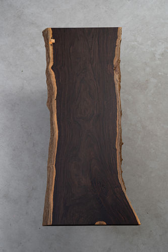 African Ebony is one of the densest, slowest-growing hardwoods, prized for its deep black-brown colour and fine, closed grain. Its natural intensity and rarity make it a refined choice for luxury furniture and objects requiring precision and durability. Each slab rewards close viewing with subtle tonal variation.
You favor high-contrast, avant-garde design and unapologetic luxury. You want a dense, pitch-black centerpiece that commands absolute attention and offers dramatic visual weight.