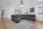 Luxury home living area with sectional sofa, 'Music City' decor