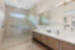 Luxury bathroom with glass shower and double vanity
