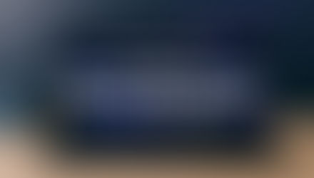 Laptop screen showing futuristic AI-powered Comet browser with sidebar assistant and comet streak graphic, NFSTUBE