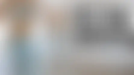 Bright home gym scene showing yoga mat, laptop with workout video, and dumbbells — ideal for Chloe Ting home fitness.