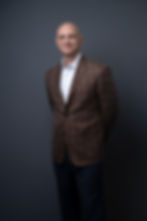 Headshot of Dr. Justin Faye featured alongside his professional bio, highlighting his expertise.