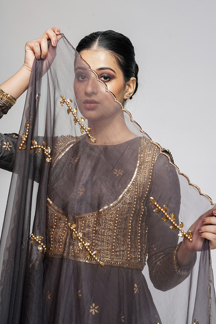 Thumbnail: Soft, sheer organza dupatta with subtle sheen paired perfectly with the grey silk anarkali by SHRUTI S