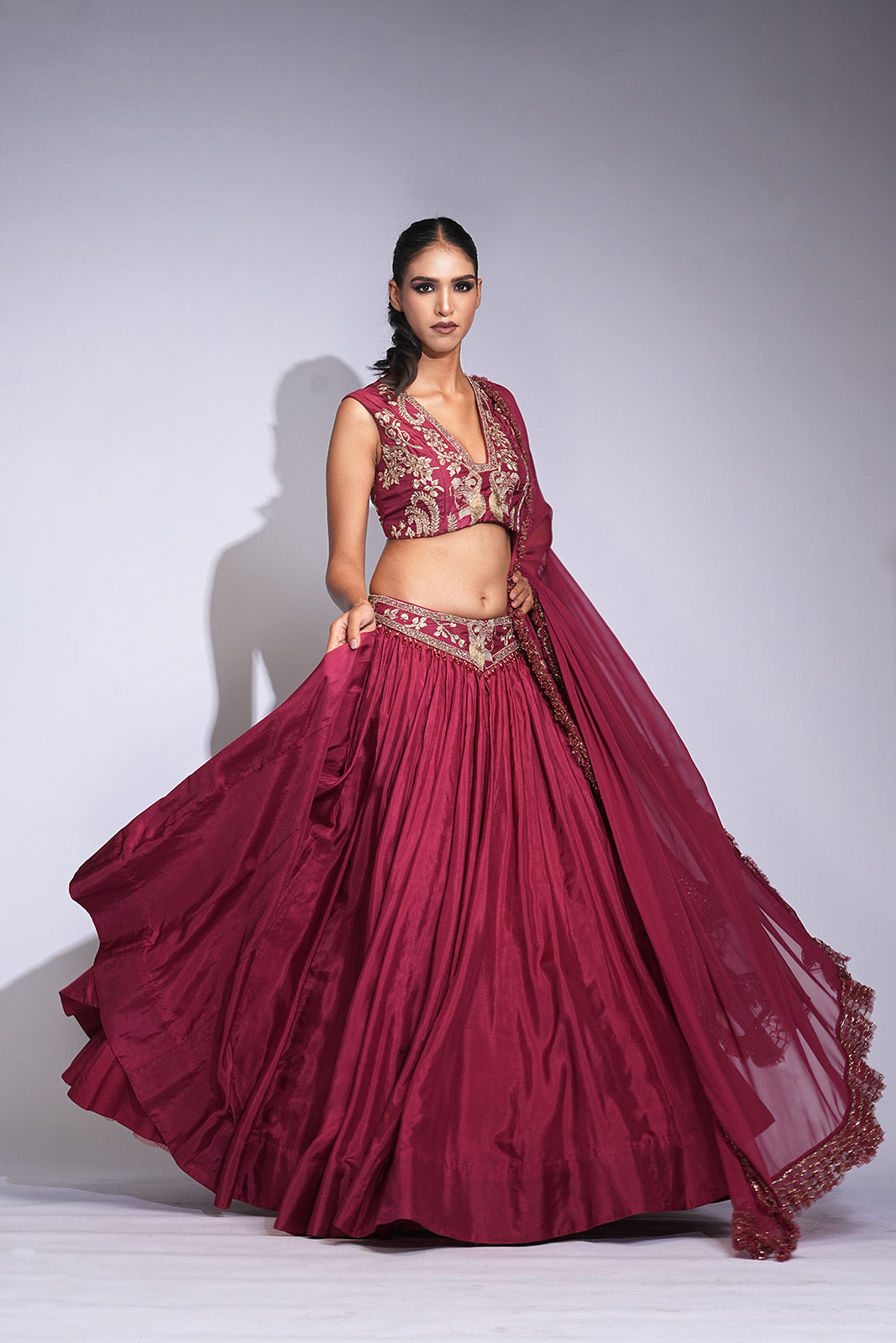 Maroon silk lehenga with gold zari embroidery, frill dupatta and tassel belt – Divine Collection by SHRUTI S