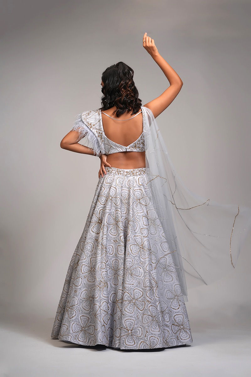 Designer lehenga set with power shoulders and delicate sequin work