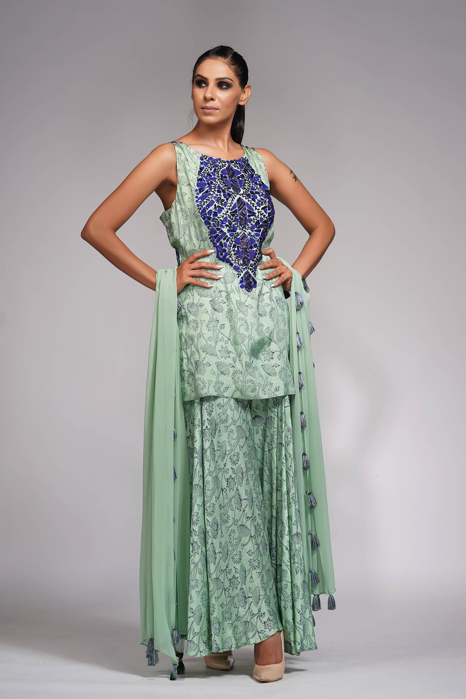 Sage green silk kurta sharara set with blue hand block print, embroidery, and tasselled organza dupatta by SHRUTI S