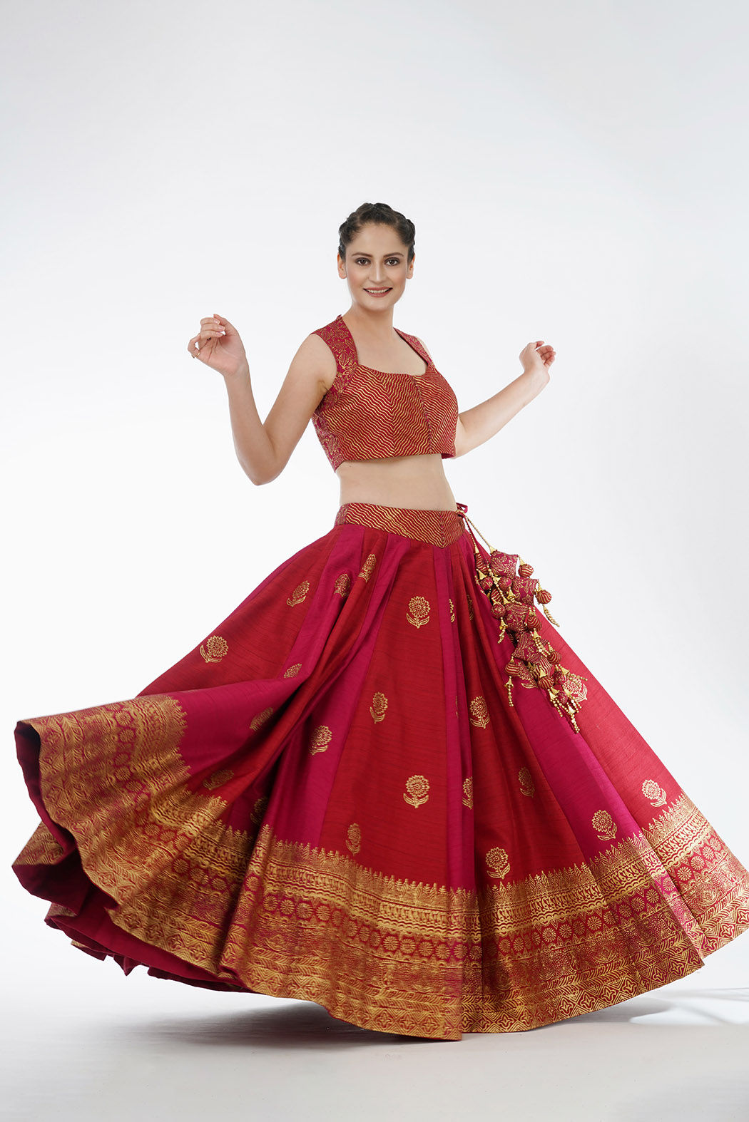 Model twirling in lightweight dual-tone lehenga with hand block printing showcasing fluidity and grace of SHRUTI S couture