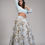 Thumbnail: Powder blue raw silk lehenga with off-gold embroidery by SHRUTI S Feather-trimmed silk blouse with bow-tie back