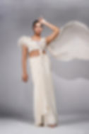 Off-white draped saree in crepe with feather blouse by SHRUTI S Designer cocktail saree for women with upcycled sequins work