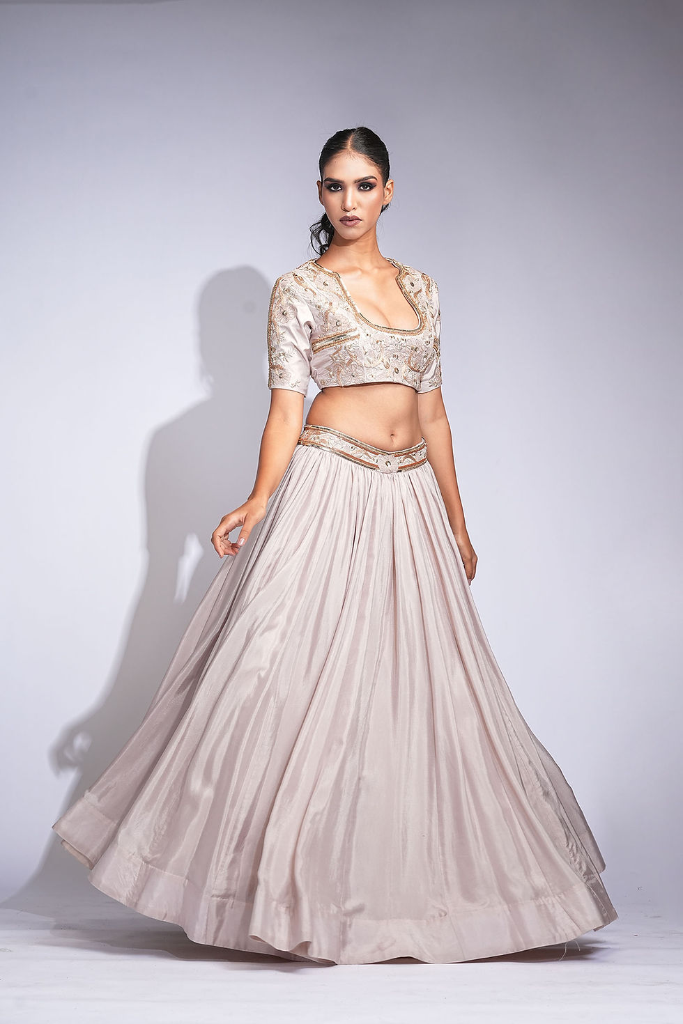 Thumbnail: V-shaped embroidered belt on silk lehenga in nude-beige – couture piece by SHRUTI S.