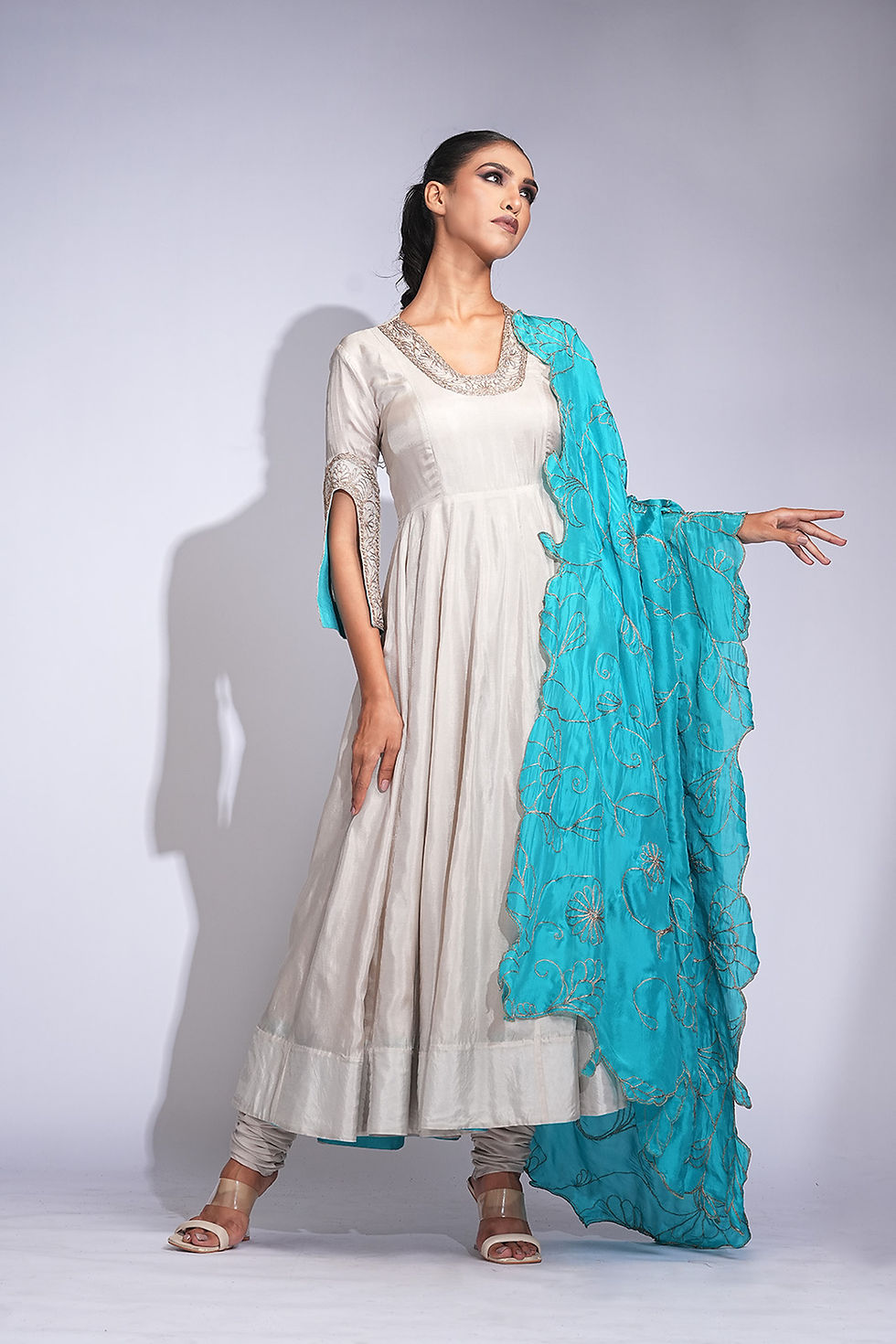 Thumbnail: Taupe and turquoise silk Anarkali suit with antique gold embroidery from Upwan Collection by SHRUTI S