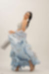 Model wearing powder blue silk lehenga with umbrella hand block print by SHRUTI S