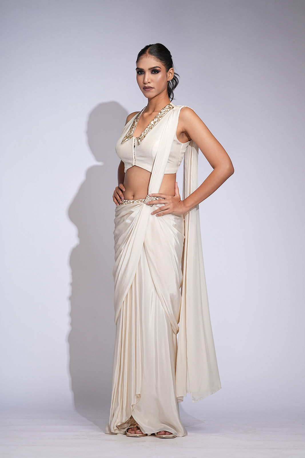 Off-white pre-stitched drape saree with embroidered gold toucan blouse | SHRUTI S – for cocktails & modern Indian events