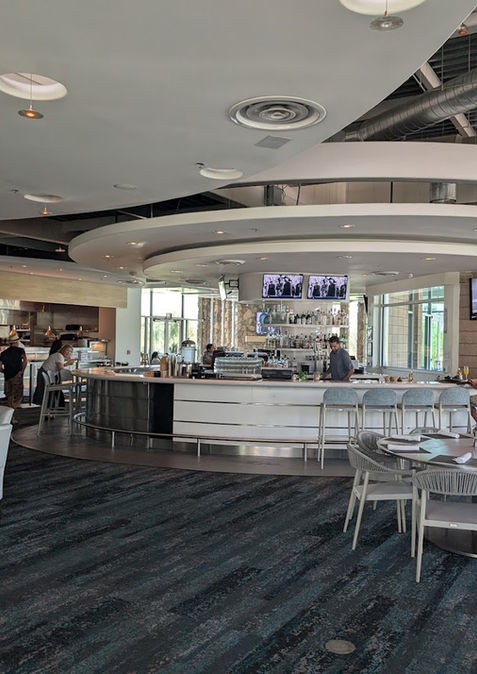 A custom curved bar at Escena Bar & Grill.