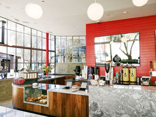 A beautiful coffee shop with a lot of windows.