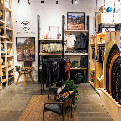 Roark store entrance with shelved clothing and display areas