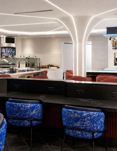 Custom bar, seating and food service millwork for the Gameway Portal Lounge airport hospitality space