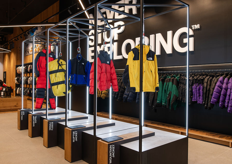 Custom made clothing racks at North Face's flagship store featuring winter coats.
