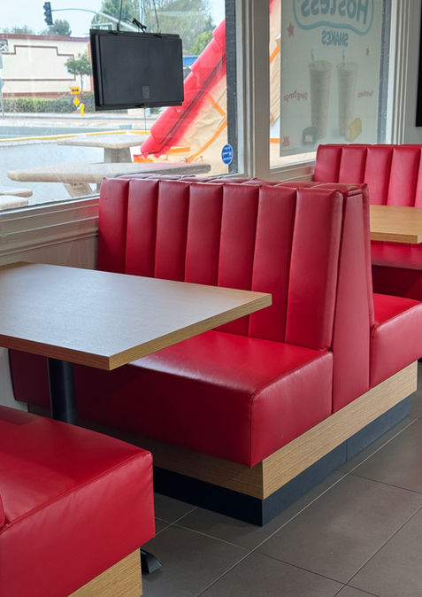 A custom red vinyl booth in a Wienerschnitzel restaurant/